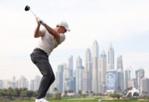 Rory McIlroy of Northern Ireland tees off on the eighth hole on day one of the Hero Dubai Desert Classic at Emirates Golf Club on January 16, 2025 in Dubai, United Arab Emirates. (Photo by Francois Nel/Getty Images)