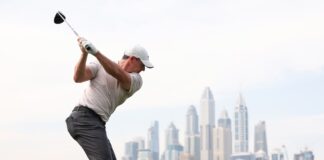 Rory McIlroy of Northern Ireland tees off on the eighth hole on day one of the Hero Dubai Desert Classic at Emirates Golf Club on January 16, 2025 in Dubai, United Arab Emirates. (Photo by Francois Nel/Getty Images)