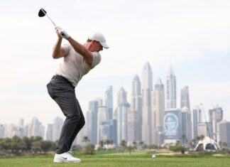 Rory McIlroy of Northern Ireland tees off on the eighth hole on day one of the Hero Dubai Desert Classic at Emirates Golf Club on January 16, 2025 in Dubai, United Arab Emirates. (Photo by Francois Nel/Getty Images)